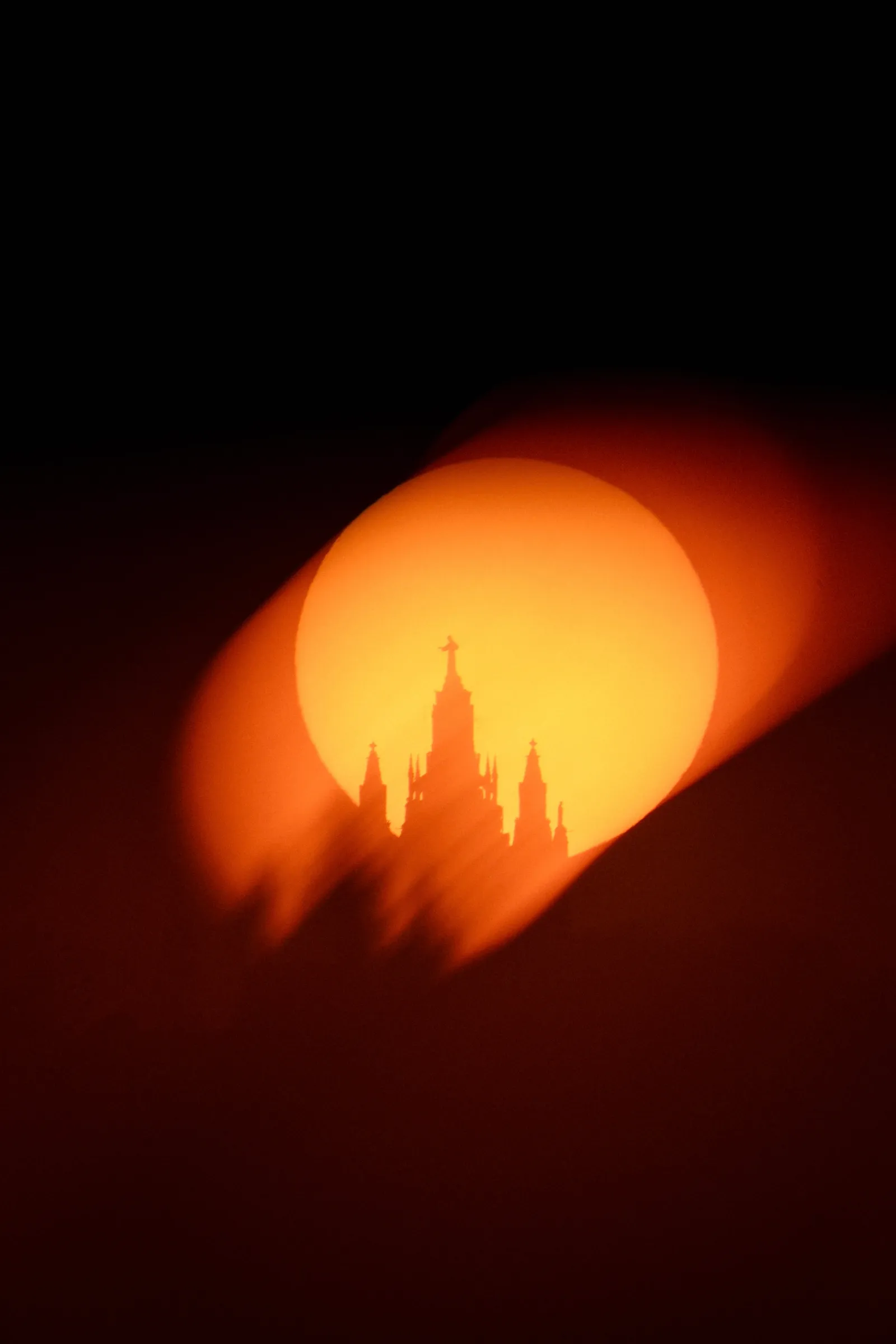 The sun setting behind Tibidabo, Barcelona